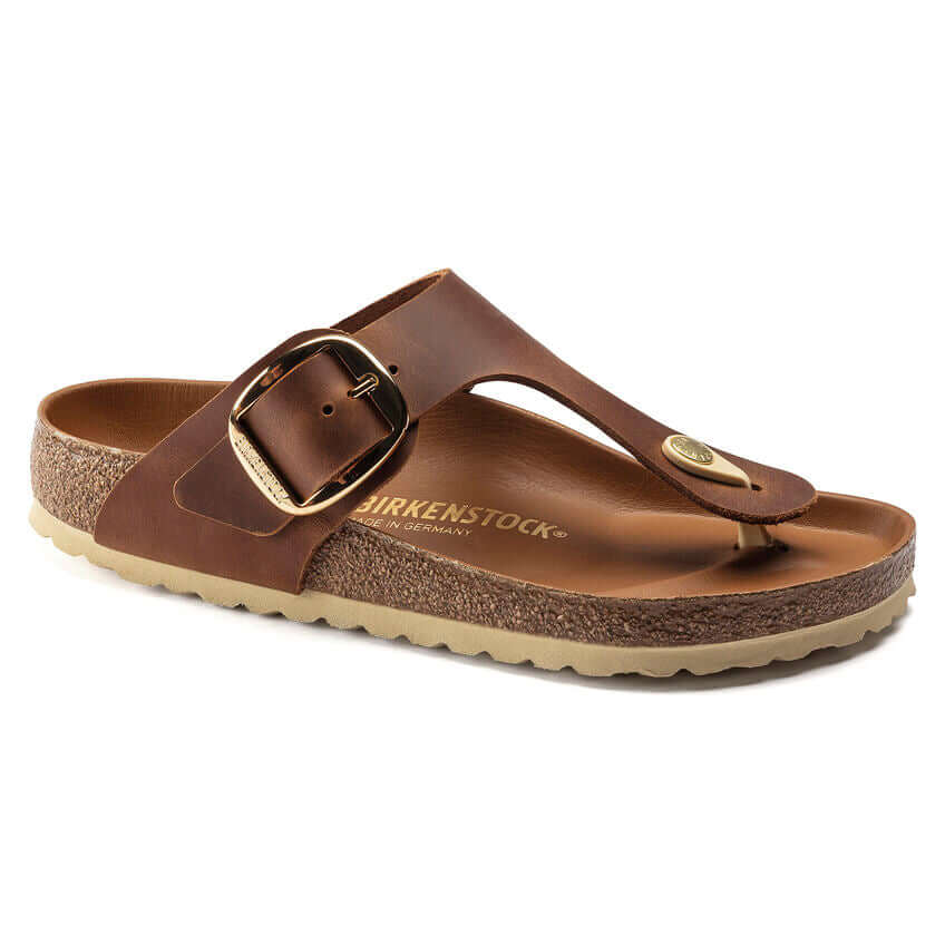 Brown Birkenstock thong sandal with adjustable strap and cork sole