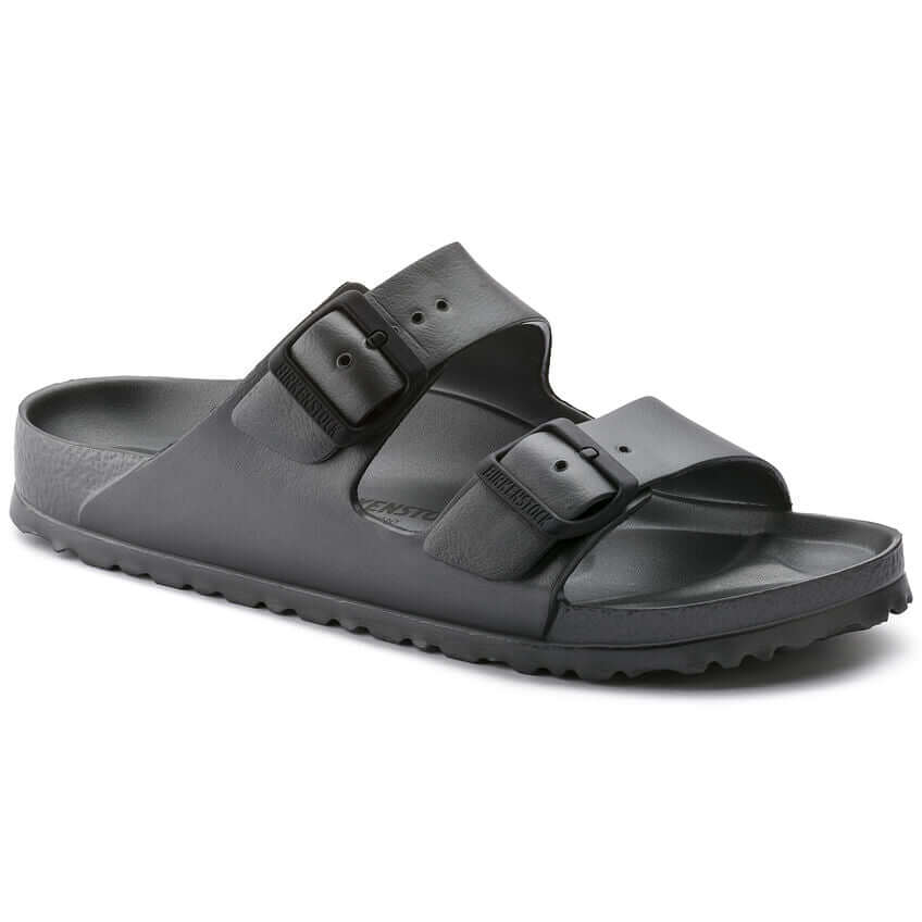 Black slide sandal with dual buckle straps on slip-resistant sole