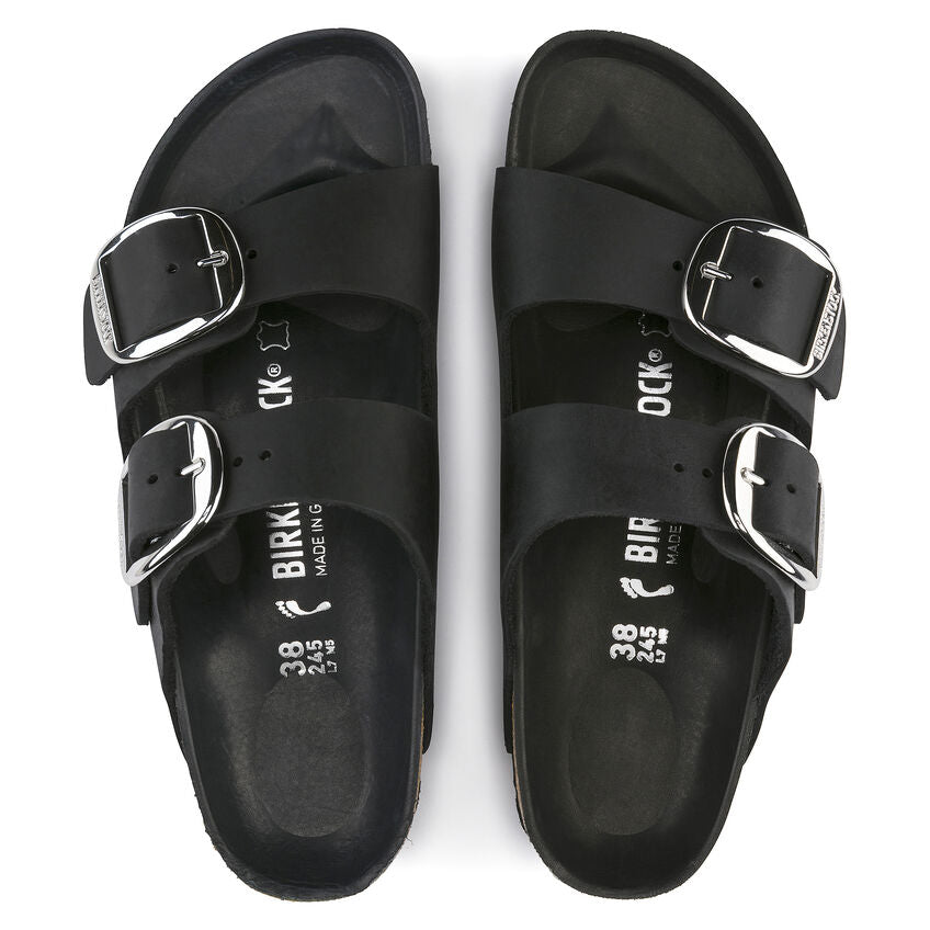 Black Birkenstock Arizona sandals with dual buckle straps and contoured footbed, top view